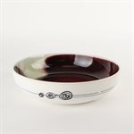 Porcelain pasta bowl with red and green interior