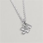 Puzzle Piece Pendant in polished silver